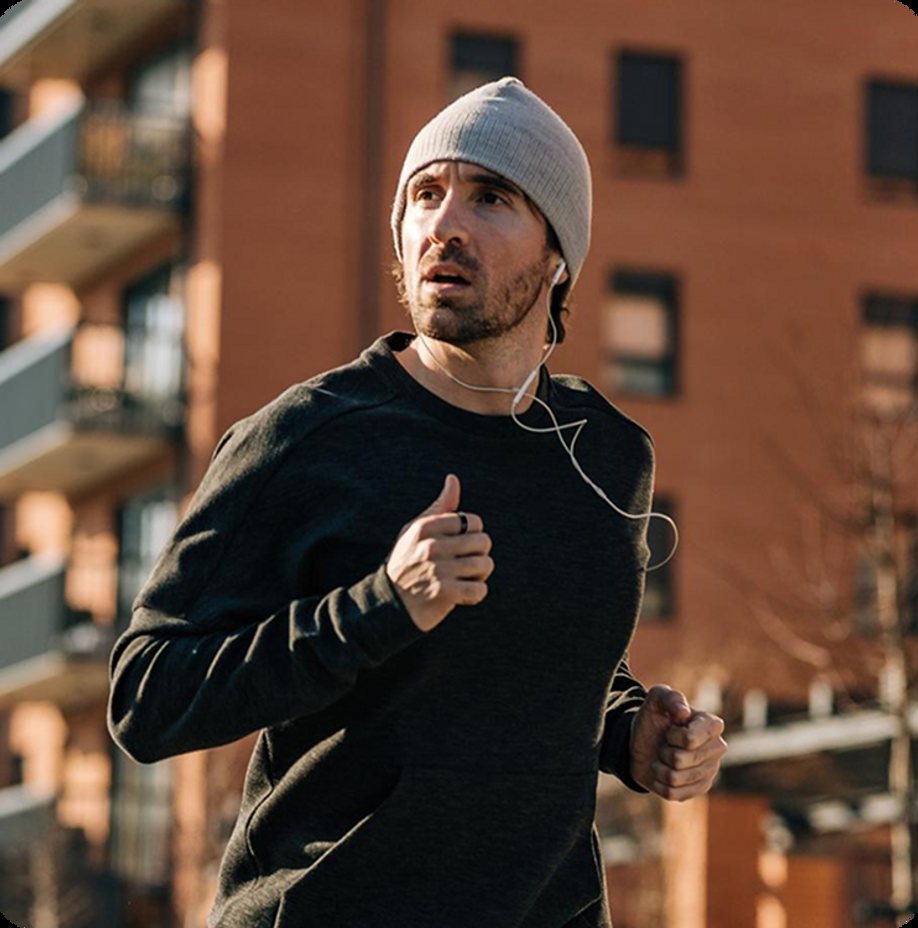 Person exercising outdoors while wearing Actxa activity tracking